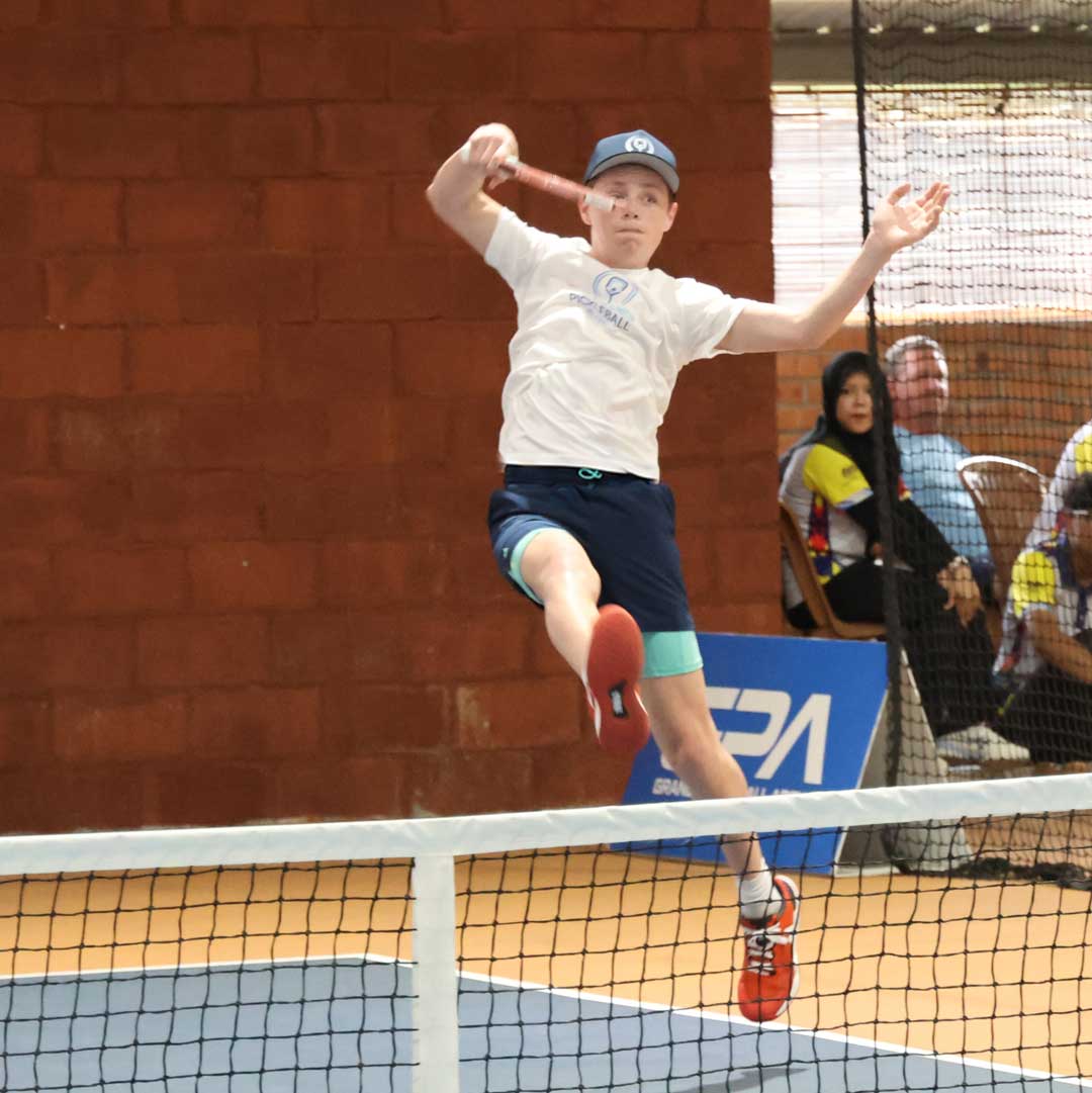 Austin Romaguera during doubles competition in front of a crowd